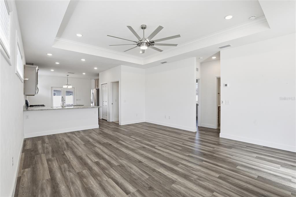 24302 Southwest 18th Road Newberry, FL 32669 - Photo 3 of 30 a view of an empty room with kitchen view and a window