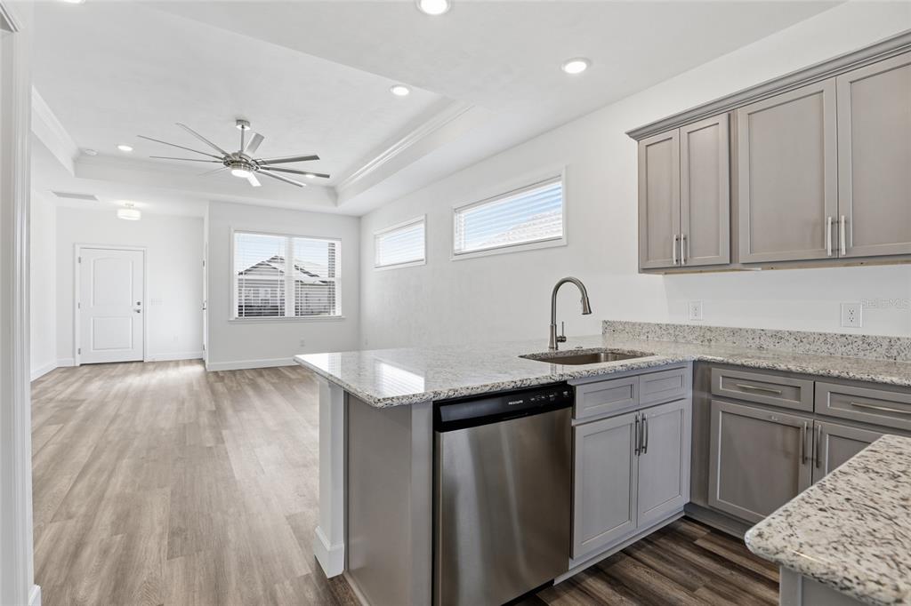 24302 Southwest 18th Road Newberry, FL 32669 - Photo 7 of 30 a kitchen with a sink cabinets and window