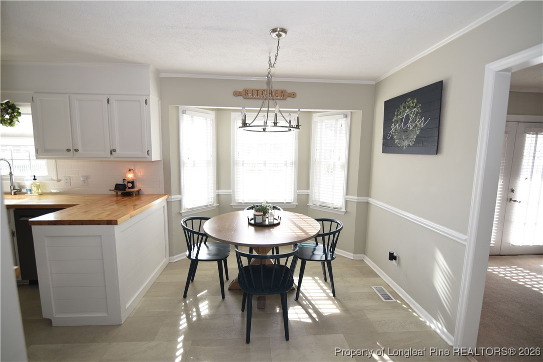 210 Tartan Road Lumberton, NC 28358 - Photo 11 of 38 a view of a dining room with furniture window and outside view