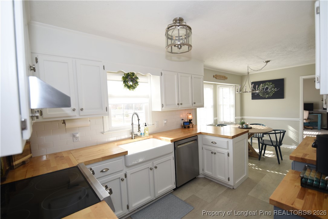 210 Tartan Road Lumberton, NC 28358 - Photo 12 of 38 a kitchen with a sink cabinets and window