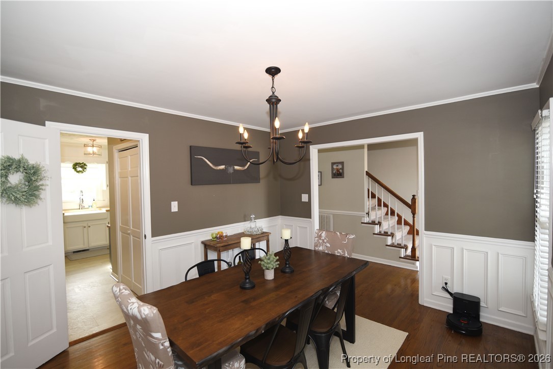 210 Tartan Road Lumberton, NC 28358 - Photo 19 of 38 a view of a dining room with furniture and wooden floor