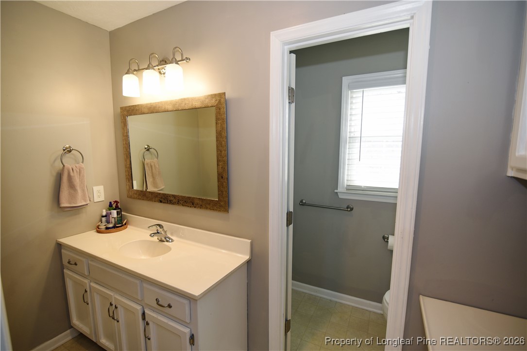 210 Tartan Road Lumberton, NC 28358 - Photo 24 of 38 a bathroom with a sink and a mirror