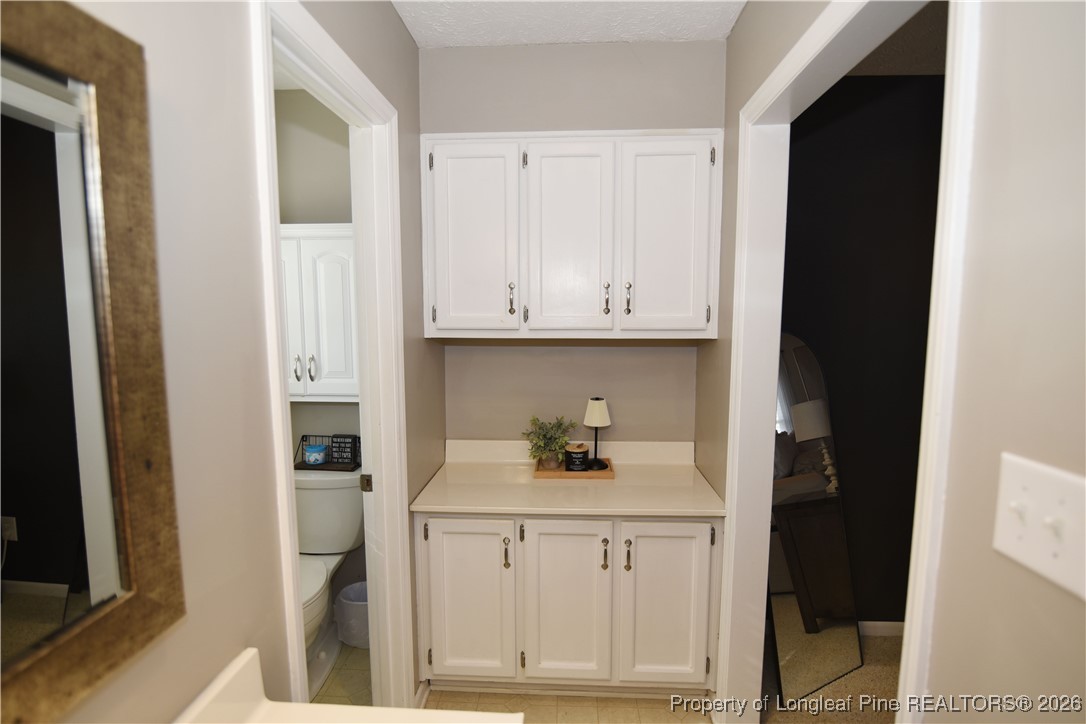 210 Tartan Road Lumberton, NC 28358 - Photo 25 of 38 a view of cabinets and wooden floor