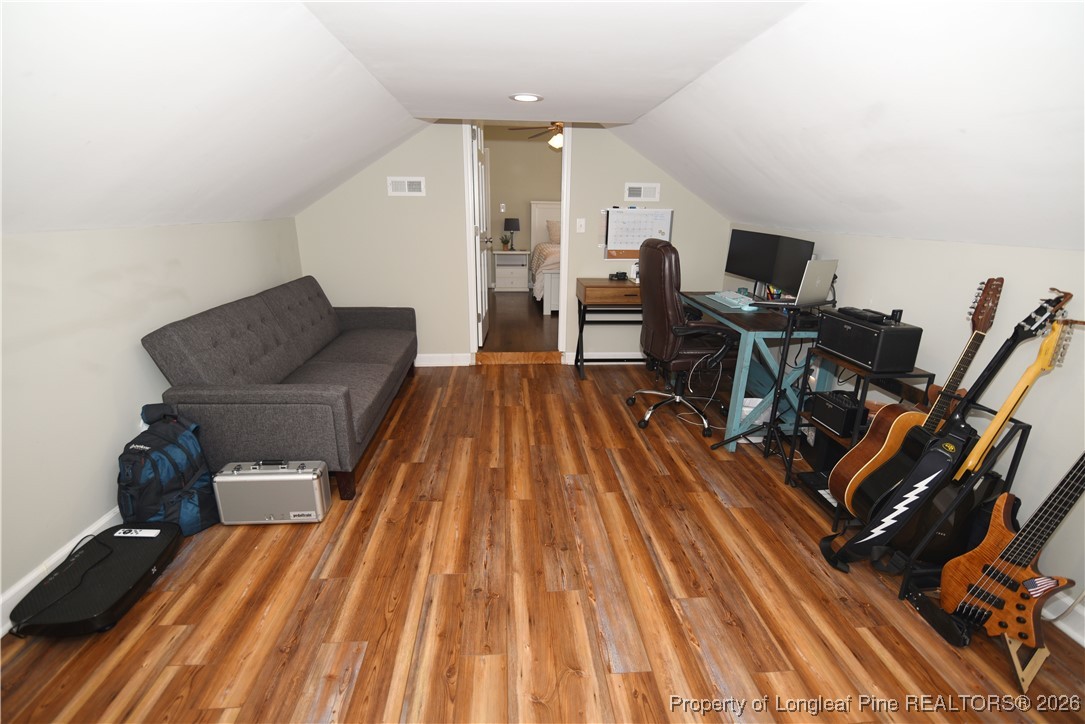 210 Tartan Road Lumberton, NC 28358 - Photo 32 of 38 a living room with a couch and a wooden floor