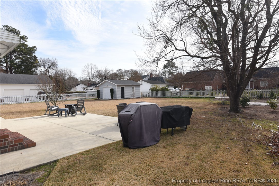 210 Tartan Road Lumberton, NC 28358 - Photo 36 of 38 a view of a swimming pool with a lounge chair