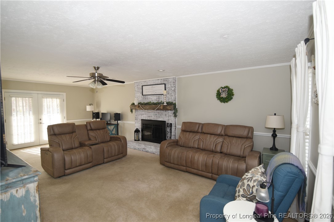 210 Tartan Road Lumberton, NC 28358 - Photo 5 of 38 a living room with furniture and a fireplace
