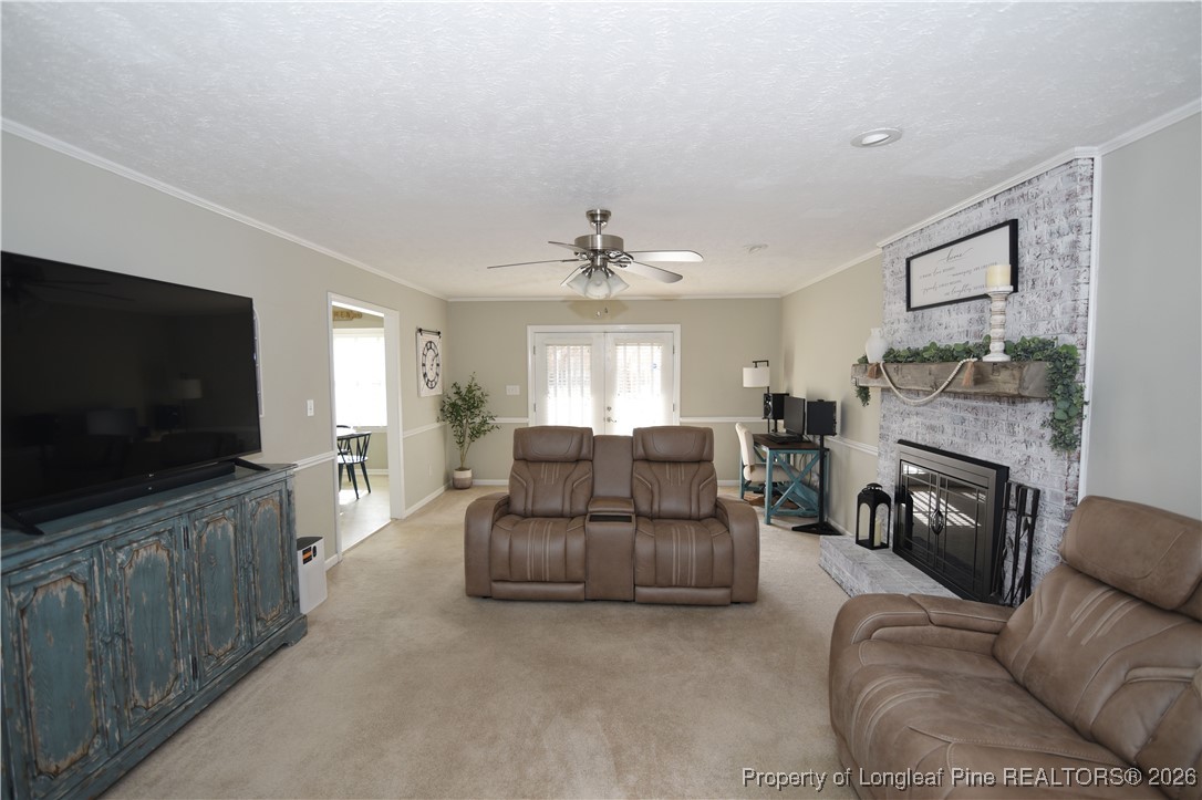 210 Tartan Road Lumberton, NC 28358 - Photo 6 of 38 a living room with furniture and a flat screen tv