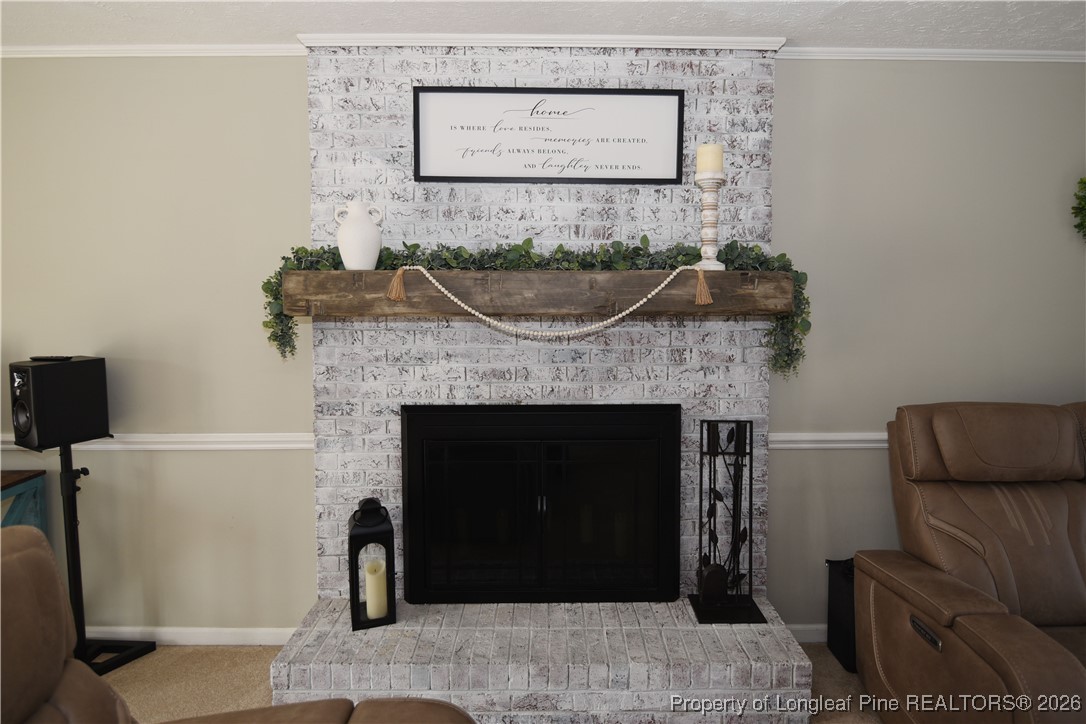 210 Tartan Road Lumberton, NC 28358 - Photo 7 of 38 a living room with furniture and a fireplace