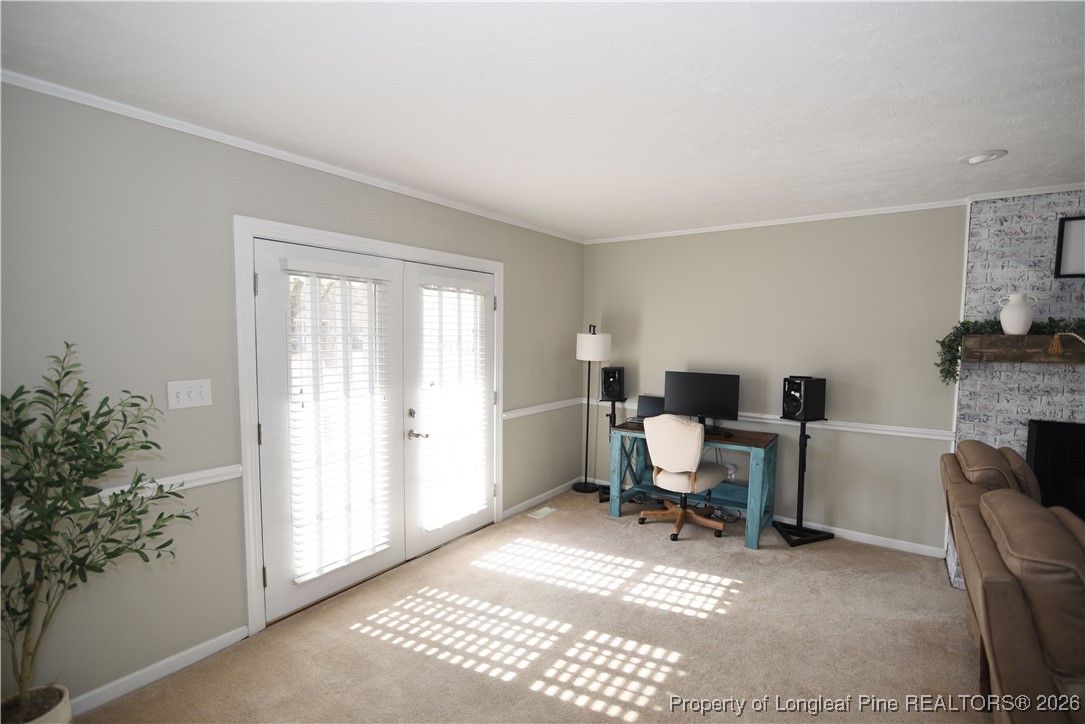 210 Tartan Road Lumberton, NC 28358 - Photo 9 of 38 a view of a workspace with furniture and a window