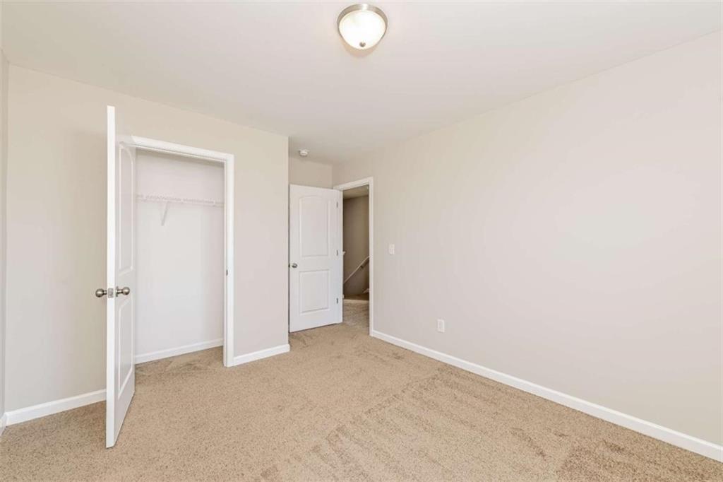 40 Tuesday Court Covington, GA 30016 - Photo 14 of 20 a view of an empty room