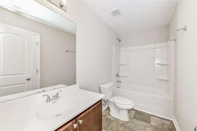 a bathroom with a sink a toilet and a bathtub