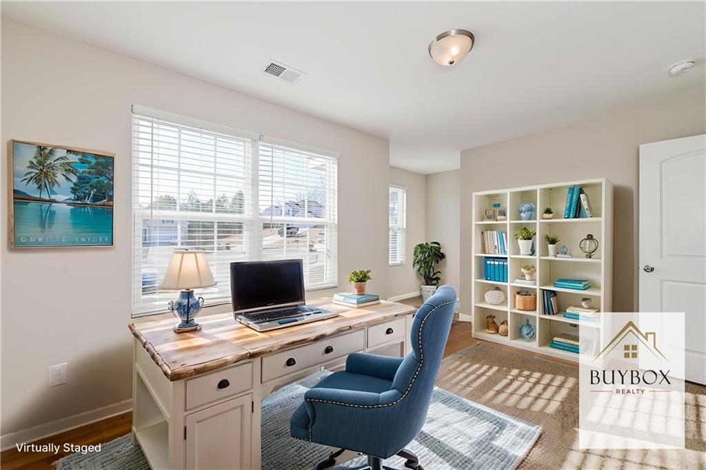 40 Tuesday Court Covington, GA 30016 - Photo 6 of 20 a view of a workspace with furniture and a window