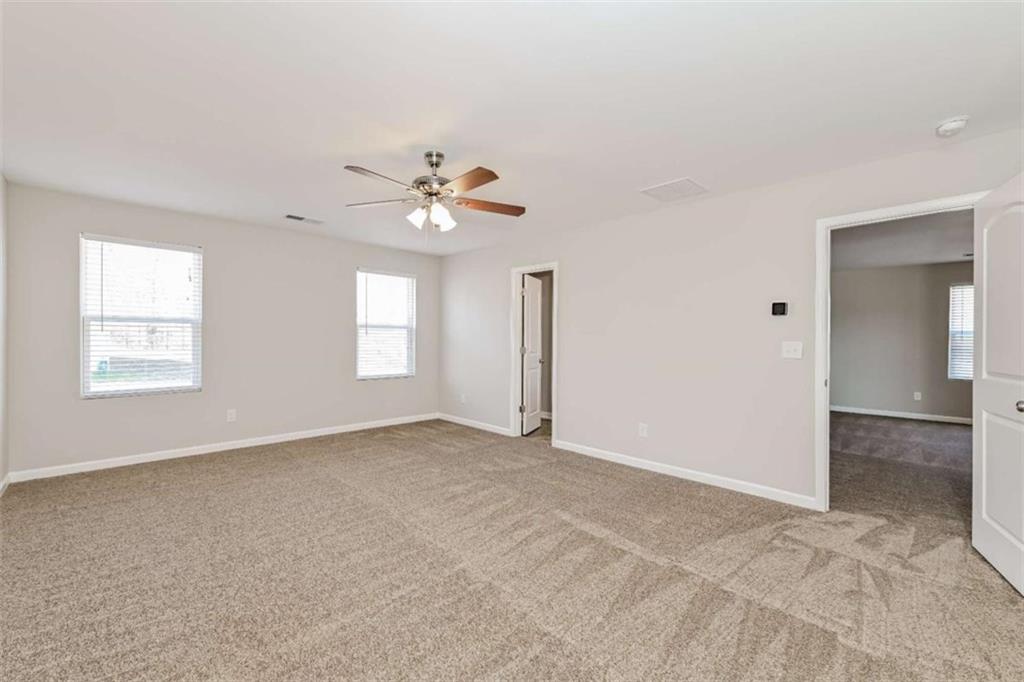40 Tuesday Court Covington, GA 30016 - Photo 8 of 20 a view of an empty room with a window