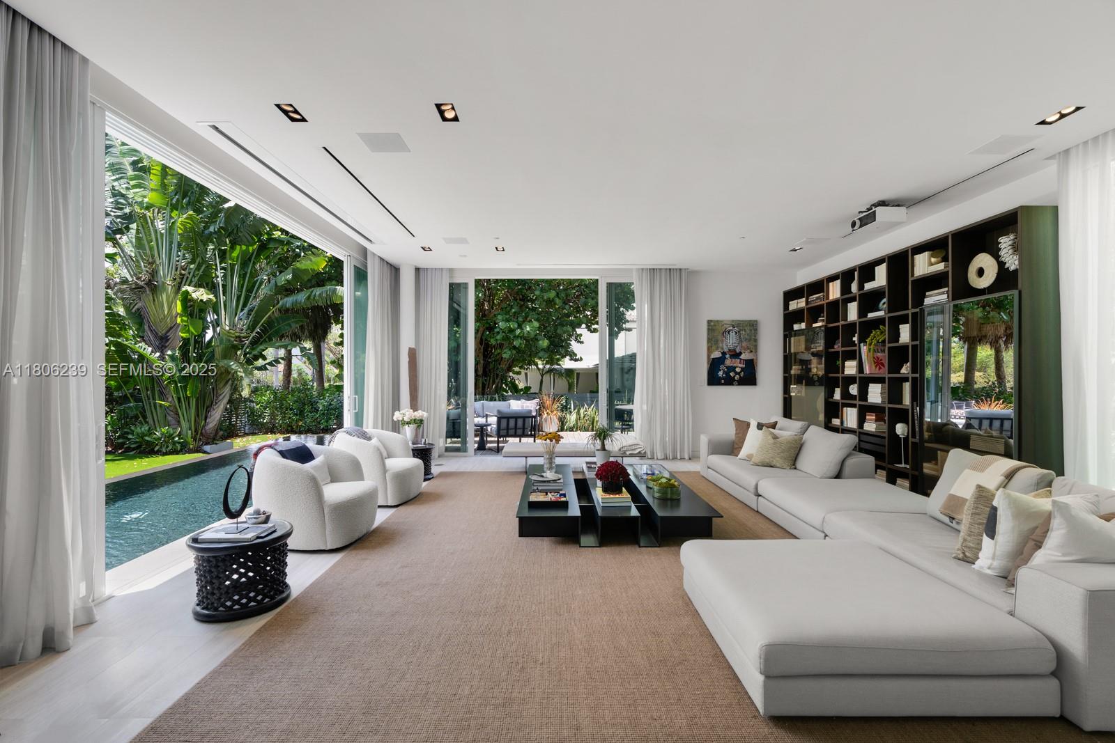 4700 Meridian Avenue Miami Beach, FL 33140 - Photo 11 of 64 a living room with furniture and large windows
