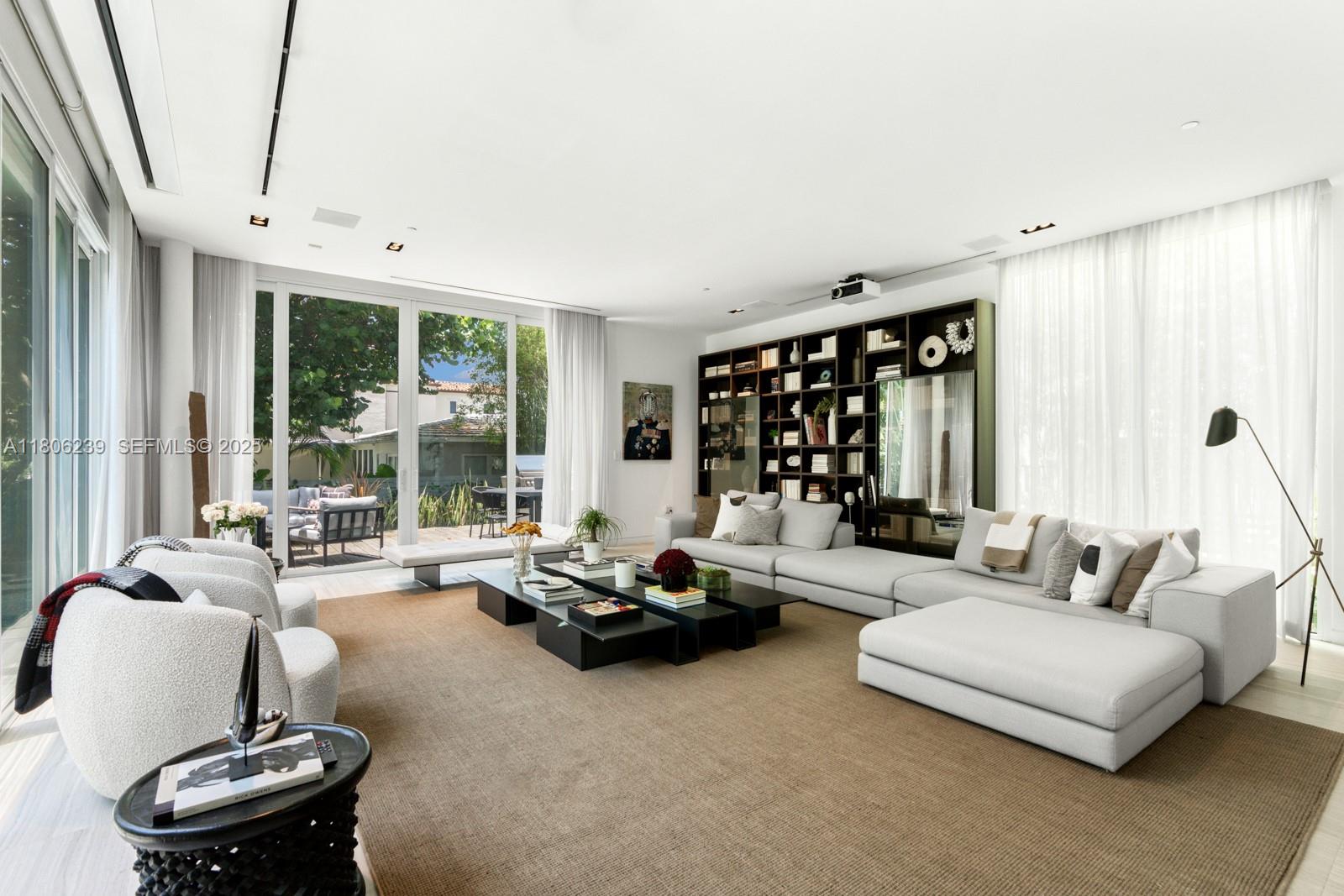 4700 Meridian Avenue Miami Beach, FL 33140 - Photo 14 of 64 a living room with furniture and large windows