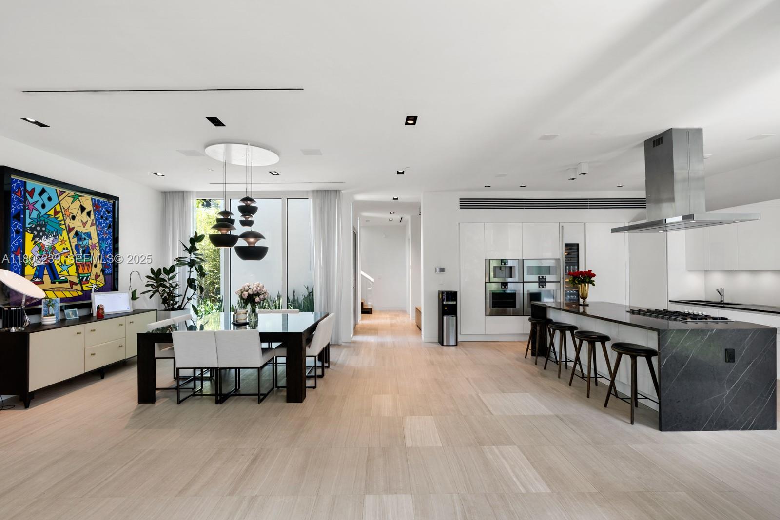 4700 Meridian Avenue Miami Beach, FL 33140 - Photo 18 of 64 a living room with furniture and a flat screen tv