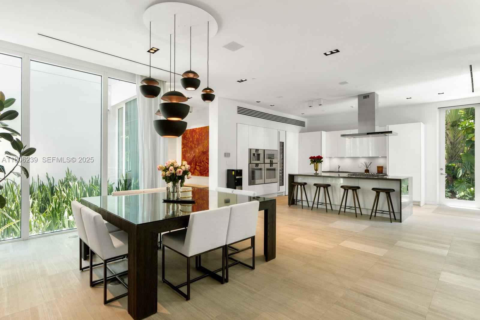 4700 Meridian Avenue Miami Beach, FL 33140 - Photo 19 of 64 a dining room with furniture and kitchen view