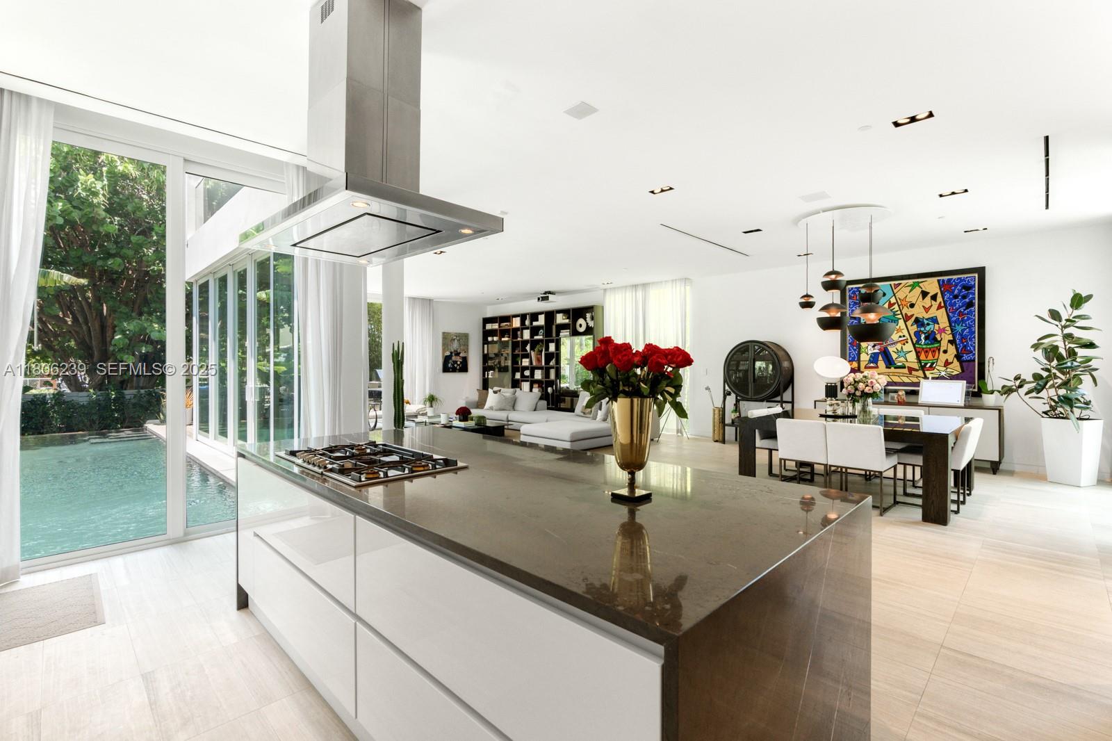 4700 Meridian Avenue Miami Beach, FL 33140 - Photo 21 of 64 a kitchen with a table and chairs in it