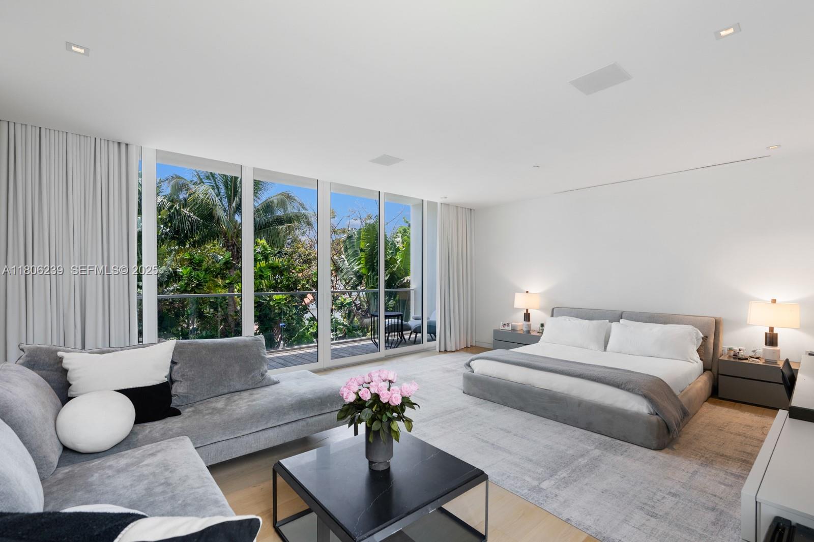 4700 Meridian Avenue Miami Beach, FL 33140 - Photo 32 of 64 a bedroom with furniture and a large window