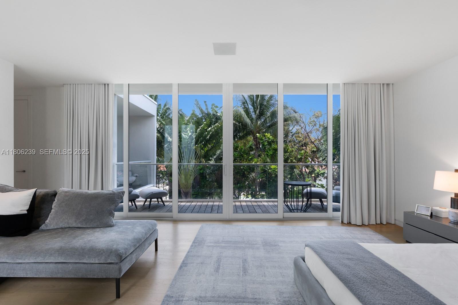 4700 Meridian Avenue Miami Beach, FL 33140 - Photo 33 of 64 a living room with furniture and a large window
