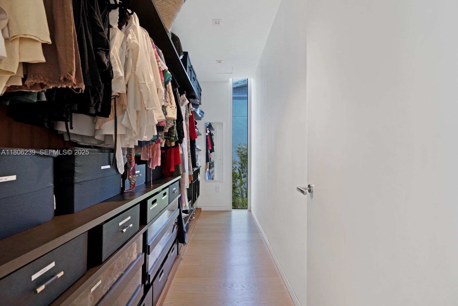 4700 Meridian Avenue Miami Beach, FL 33140 - Photo 37 of 64 a view of a hallway with wooden floor and shoes