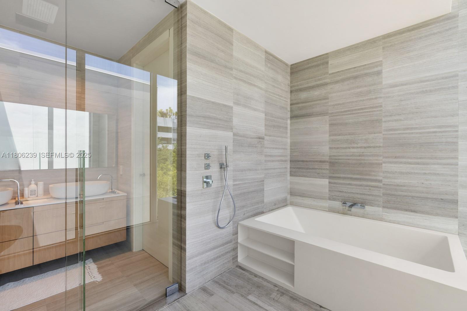 4700 Meridian Avenue Miami Beach, FL 33140 - Photo 39 of 64 a bathroom with a bathtub and a shower