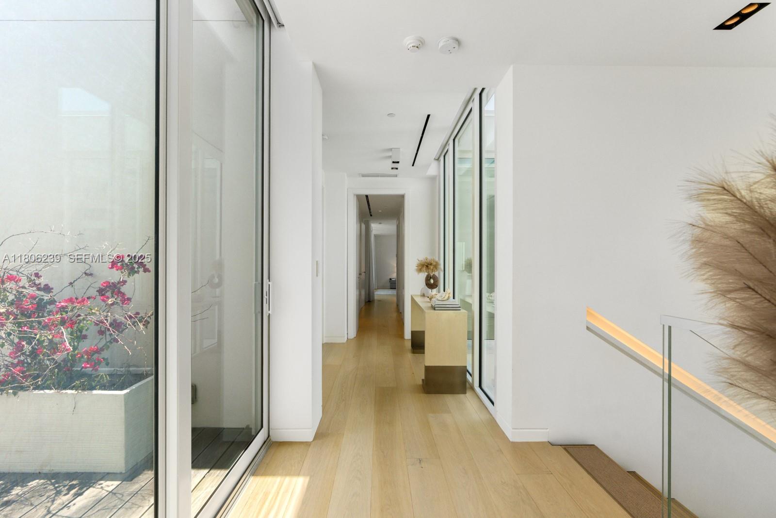 4700 Meridian Avenue Miami Beach, FL 33140 - Photo 40 of 64 a view of a hallway view with wooden floor and staircase
