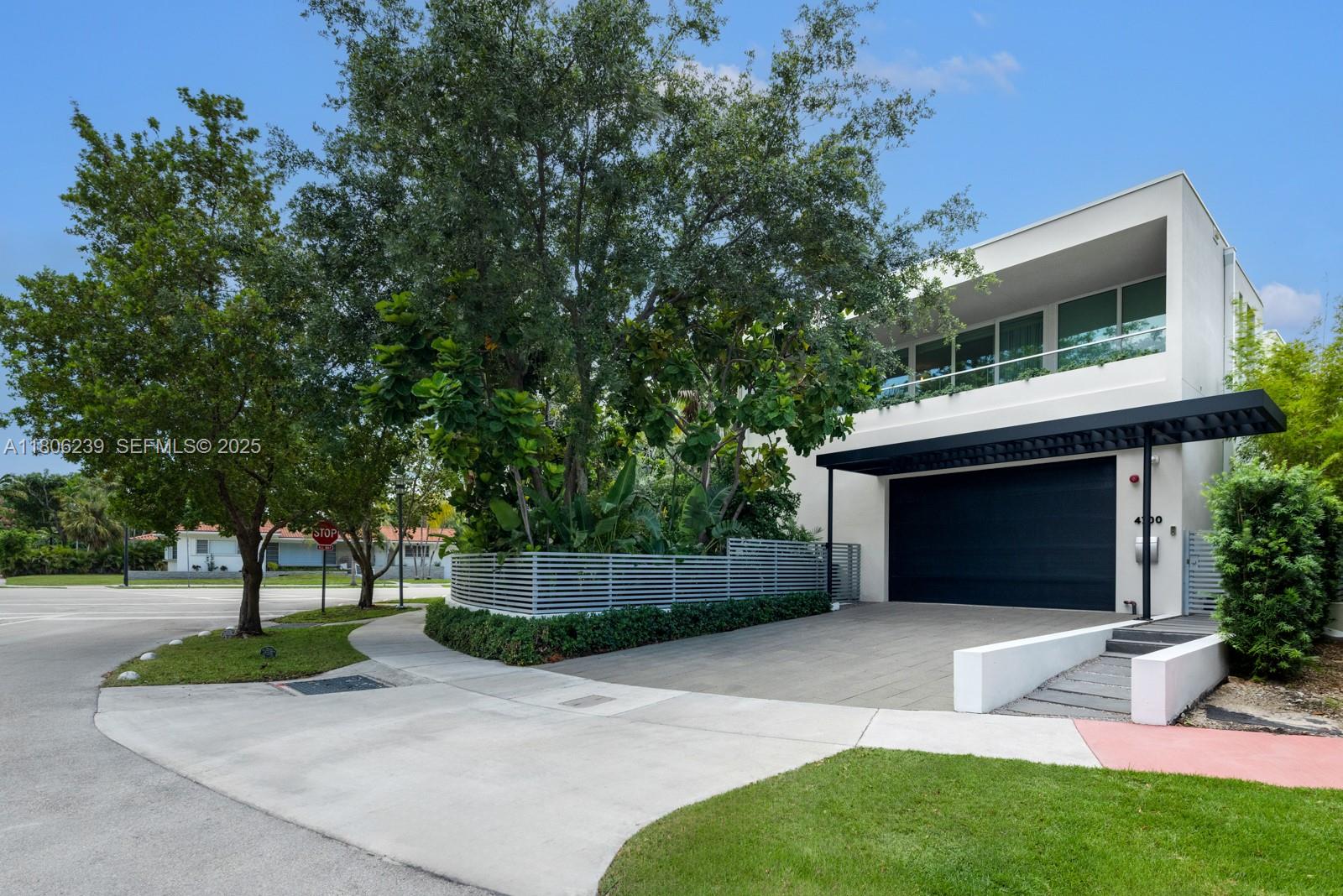 4700 Meridian Avenue Miami Beach, FL 33140 - Photo 5 of 64 a front view of a house with a yard