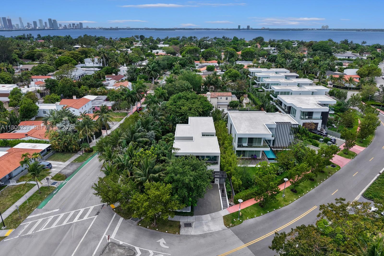 4700 Meridian Avenue Miami Beach, FL 33140 - Photo 52 of 64 an aerial view of a city with lots of residential buildings and mountain view in back