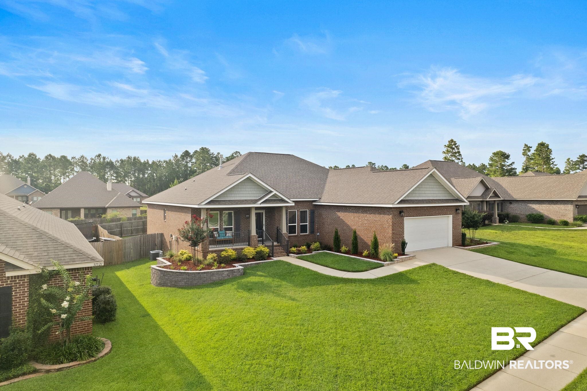 31541 Hoot Owl Road Daphne, AL 36527 - Photo 48 of 51 View of front of property featuring a garage and a front yard