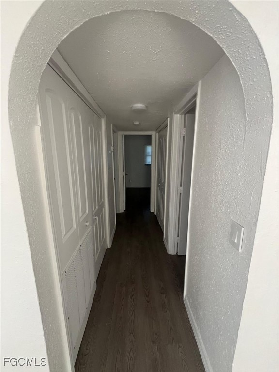 1919 Lillie Street, Unit H Fort Myers, FL 33916 - Photo 3 of 8 a view of a hallway with wooden shelves