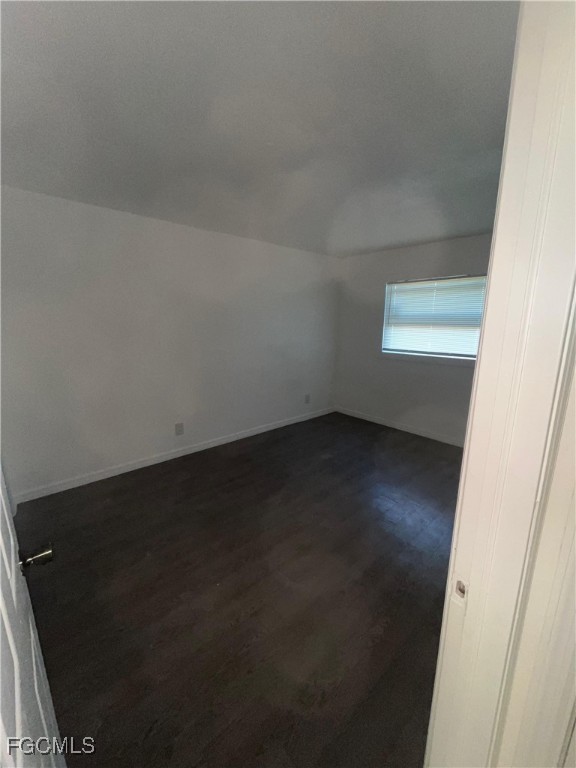 1919 Lillie Street, Unit H Fort Myers, FL 33916 - Photo 7 of 8 an empty room with a window