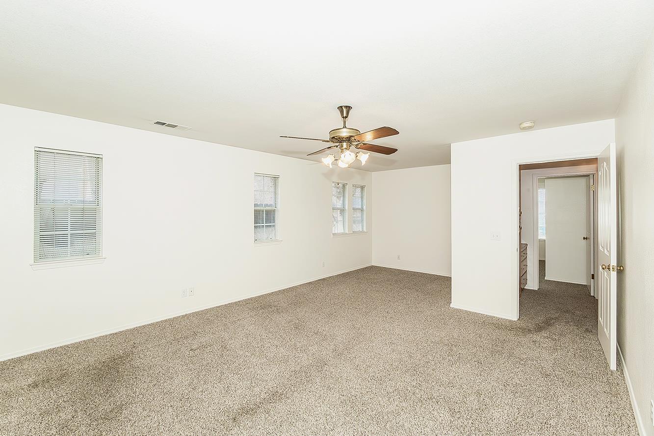1415 West Riverglen Avenue Reedley, CA 93654 - Photo 16 of 48 a view of a livingroom with a chandelier fan