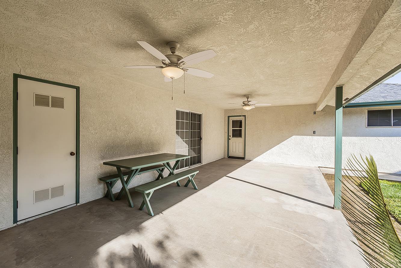 1415 West Riverglen Avenue Reedley, CA 93654 - Photo 32 of 48 a bedroom with a bed and a chandelier