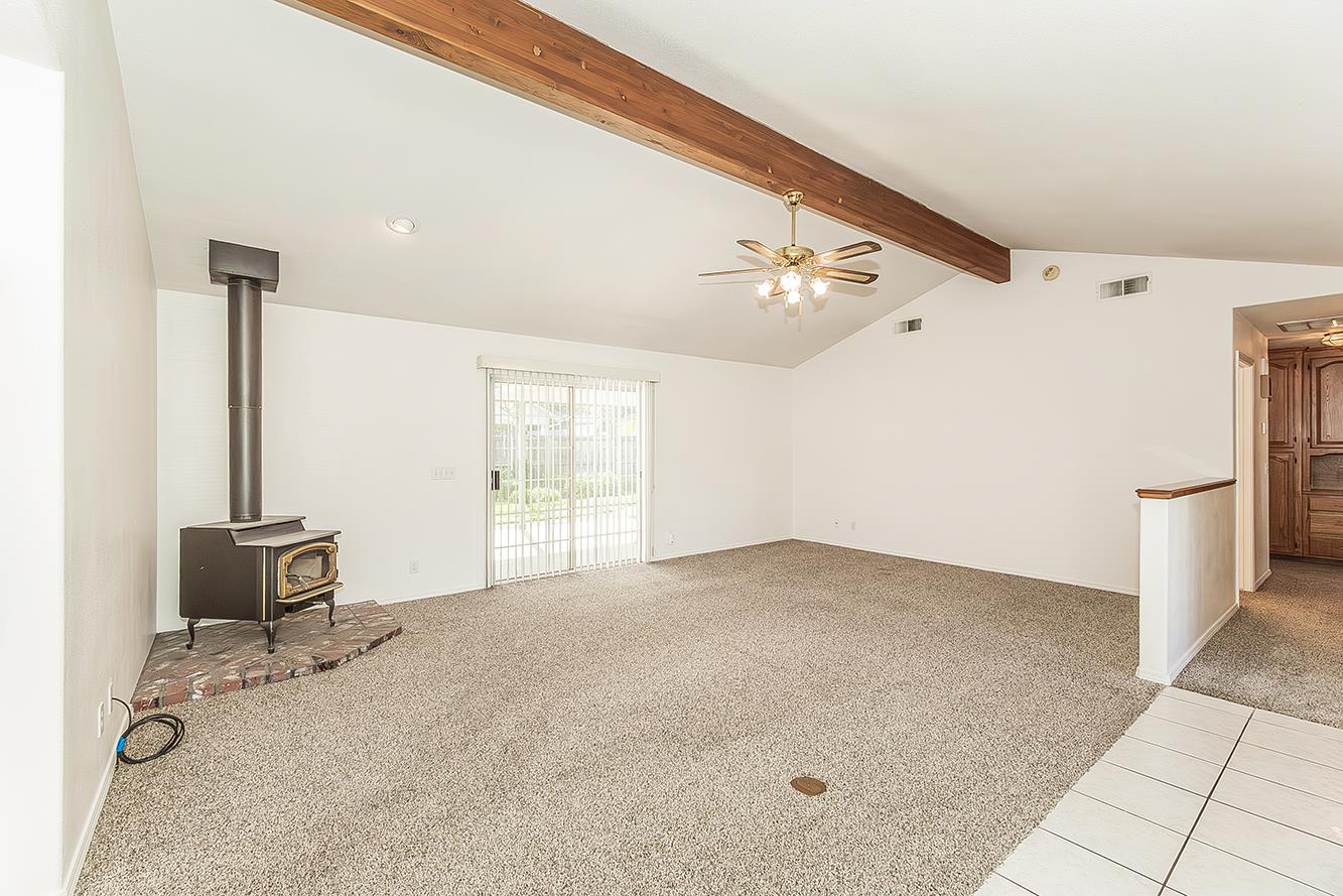 1415 West Riverglen Avenue Reedley, CA 93654 - Photo 5 of 48 a view of an empty room with a window