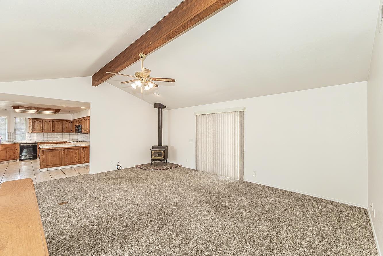1415 West Riverglen Avenue Reedley, CA 93654 - Photo 6 of 48 a view of an empty room with a window
