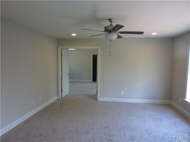 1345 Revolution Circle Raleigh, NC 27603 - Photo 13 of 20 an empty room with closet and a ceiling fan