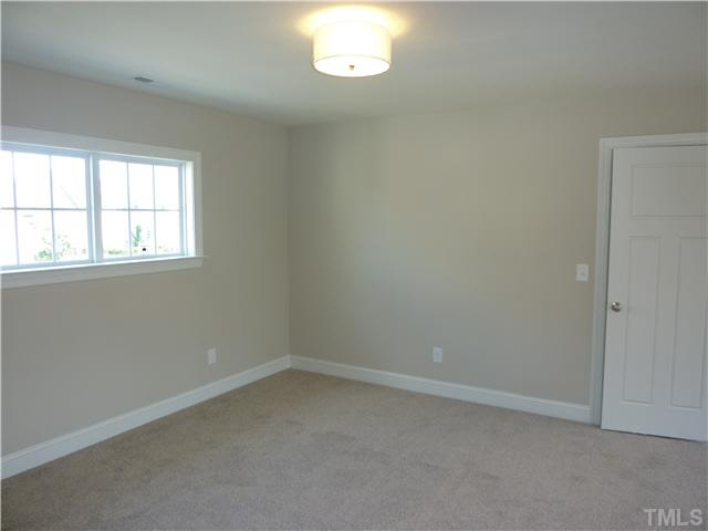 1345 Revolution Circle Raleigh, NC 27603 - Photo 14 of 20 an empty room with a window