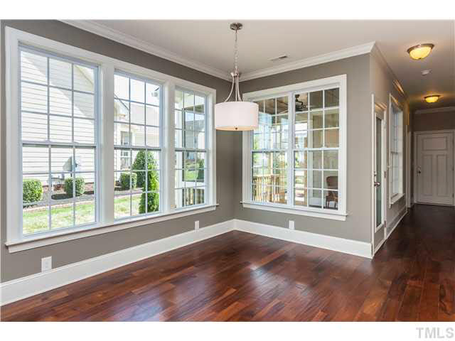 1345 Revolution Circle Raleigh, NC 27603 - Photo 5 of 20 a view of an empty room with a window and wooden floor