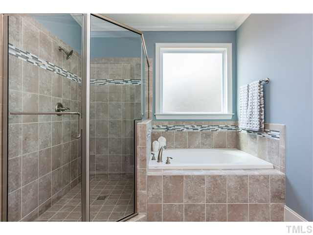 1345 Revolution Circle Raleigh, NC 27603 - Photo 10 of 20 a bath tub sitting next to a window