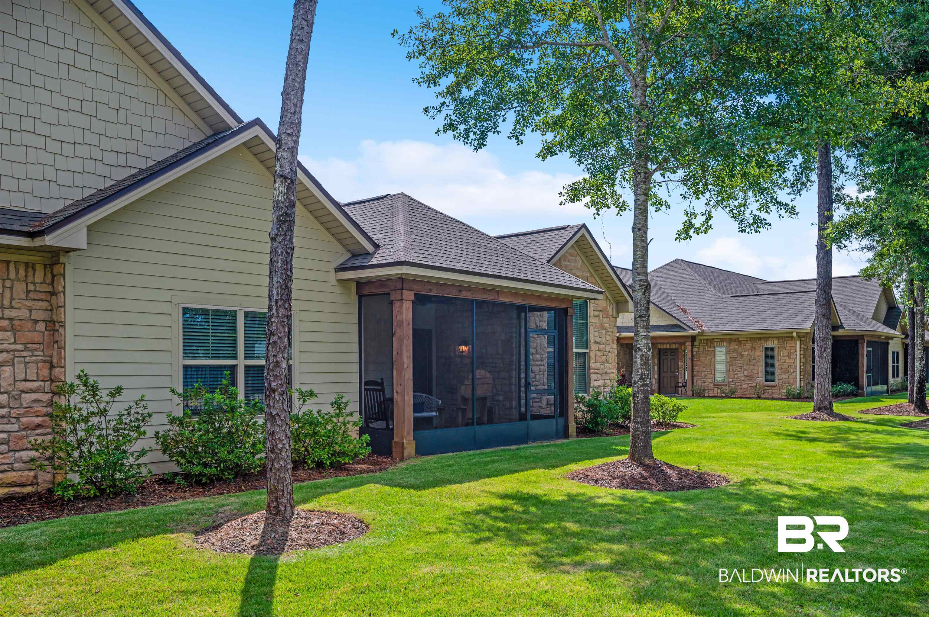 502 Holmes Avenue Foley, AL 36535 - Photo 31 of 41 Exterior space with a sunroom and a yard