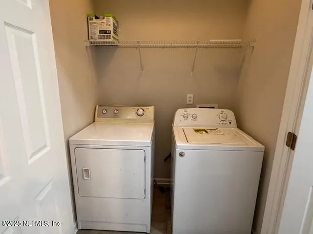 a utility room with dryer and washer