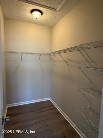 a view of a room with racks on the wall