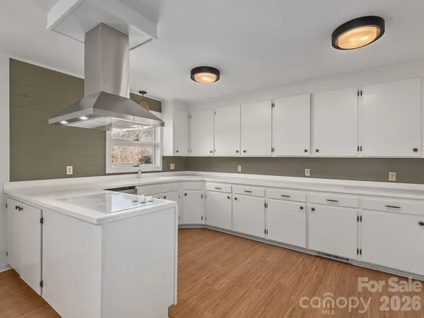 a kitchen that has a sink and a stove