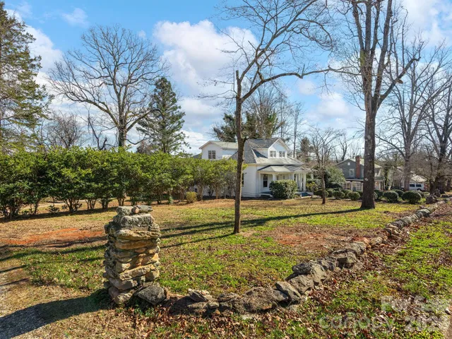 a view of a yard with an trees