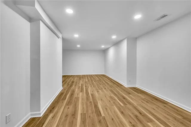 a view of wooden floor in an empty room