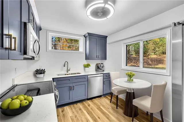 a kitchen with a table and chairs