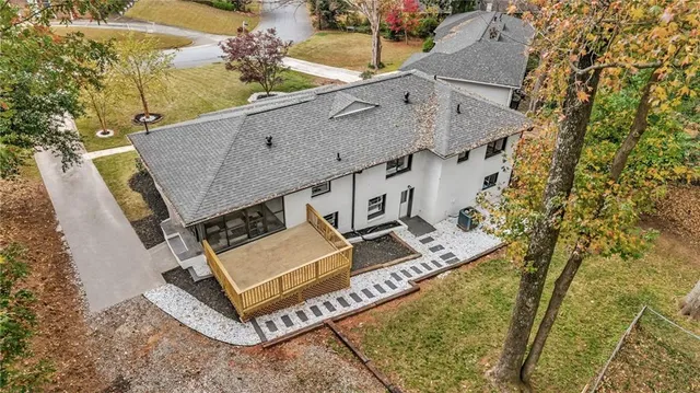 an aerial view of a house with a garden