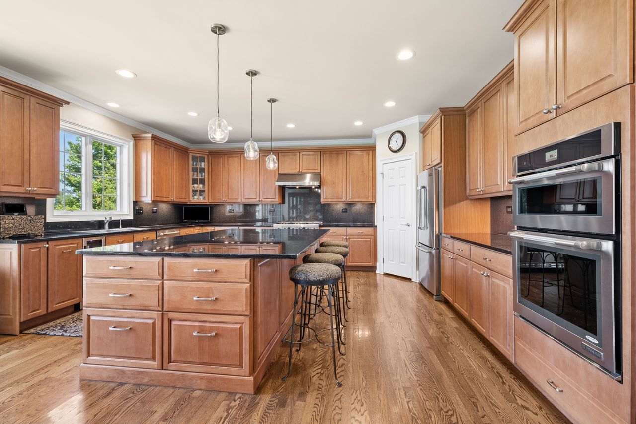 1029 Ridgeview Drive Inverness, IL 60010 - Photo 14 of 58 a kitchen with granite countertop a stove a sink a refrigerator and wooden floor