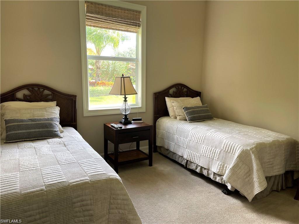 6557 Caldecott Drive Naples, FL 34113 - Photo 12 of 14 a bedroom with a bed and window